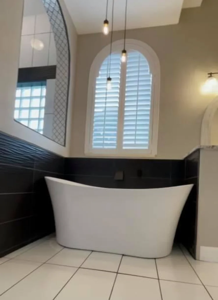 Freestanding bathtub and contrasting tile surround