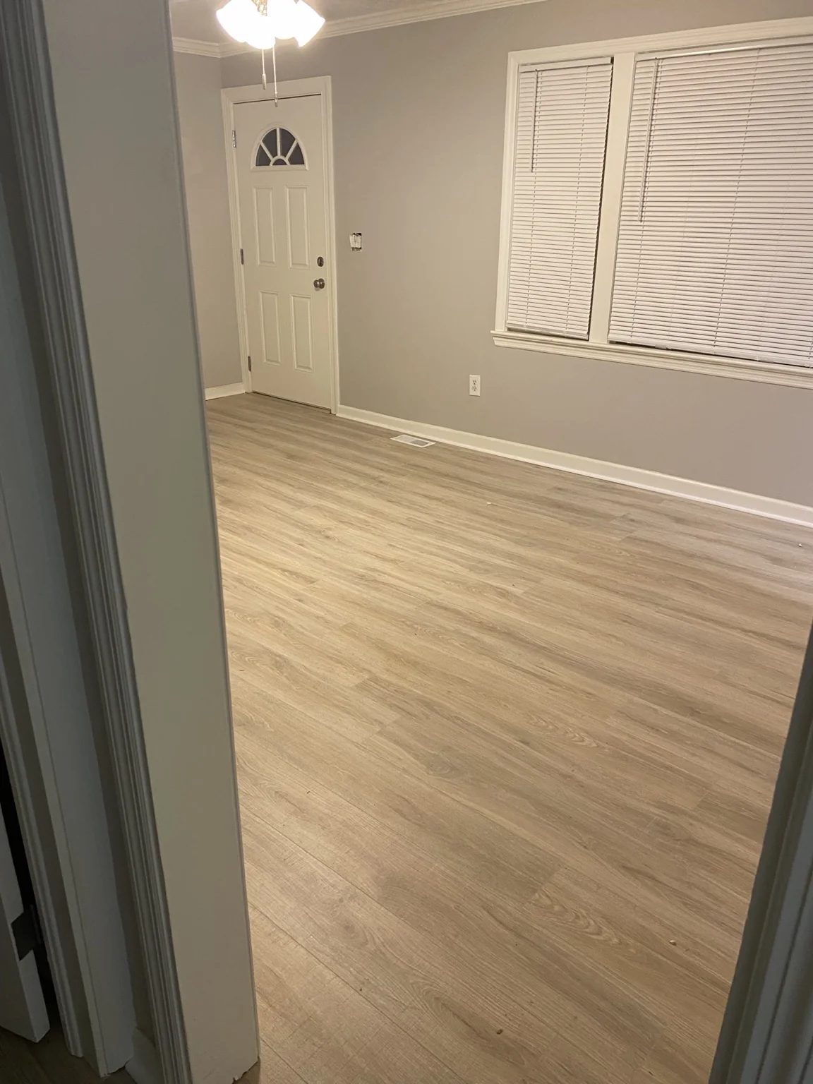 Finished plank flooring in a living room